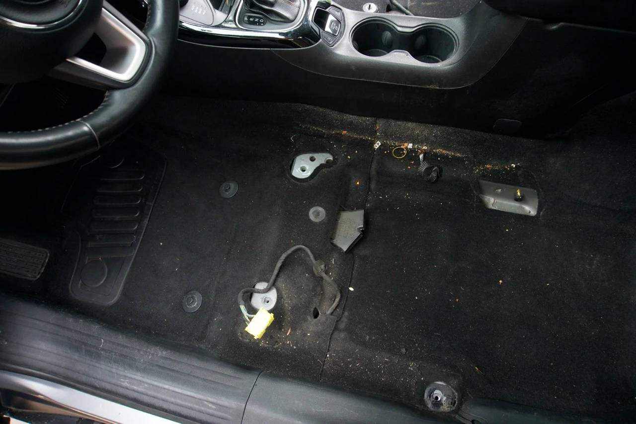 Carpet with dirt and debris before interior detailing